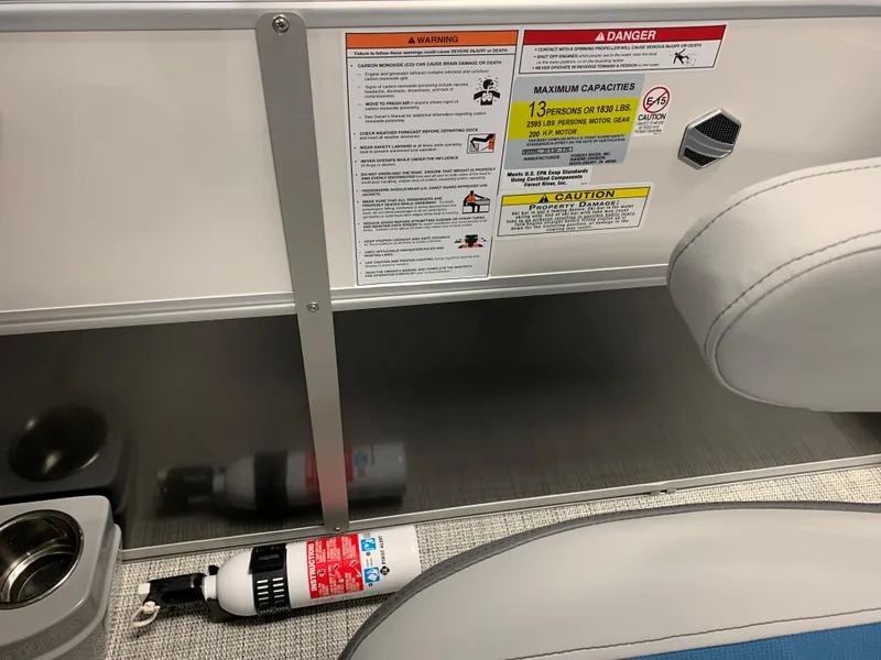 Slide: The Image of 2023 South Bay S224 RS boat safety labels and fire extinguisher. - 6