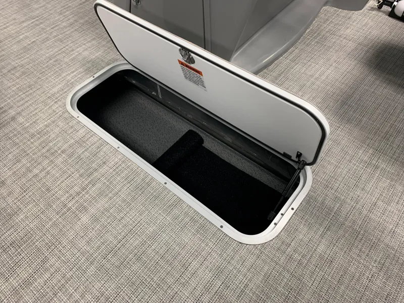 Slide: The Image of 2023 South Bay S224 RS storage compartment with open hatch. - 18