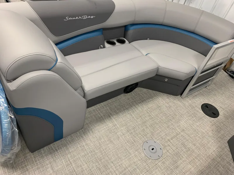 Slide: The Image of 2023 South Bay S224 RS pontoon boat interior with gray and blue seating. - 22