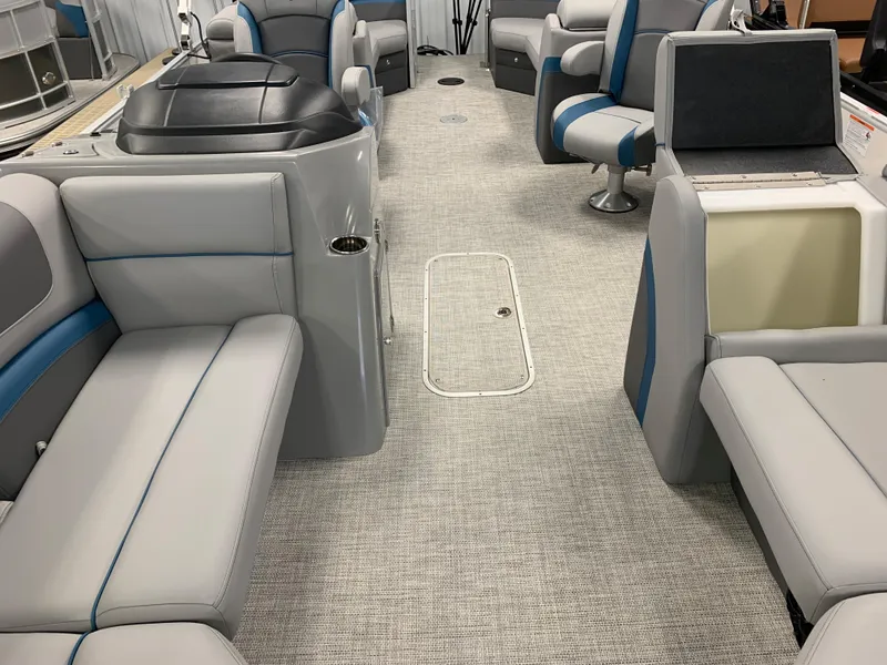 Slide: The Image of 2023 South Bay S224 RS boat interior with gray and blue seating. - 15