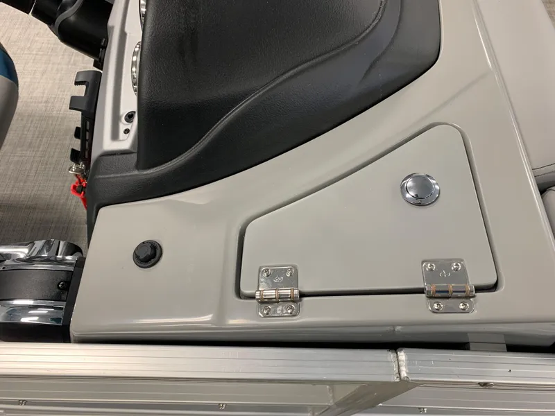 Slide: The Image of 2023 South Bay S224 RS boat console with storage compartment and black seat. - 37