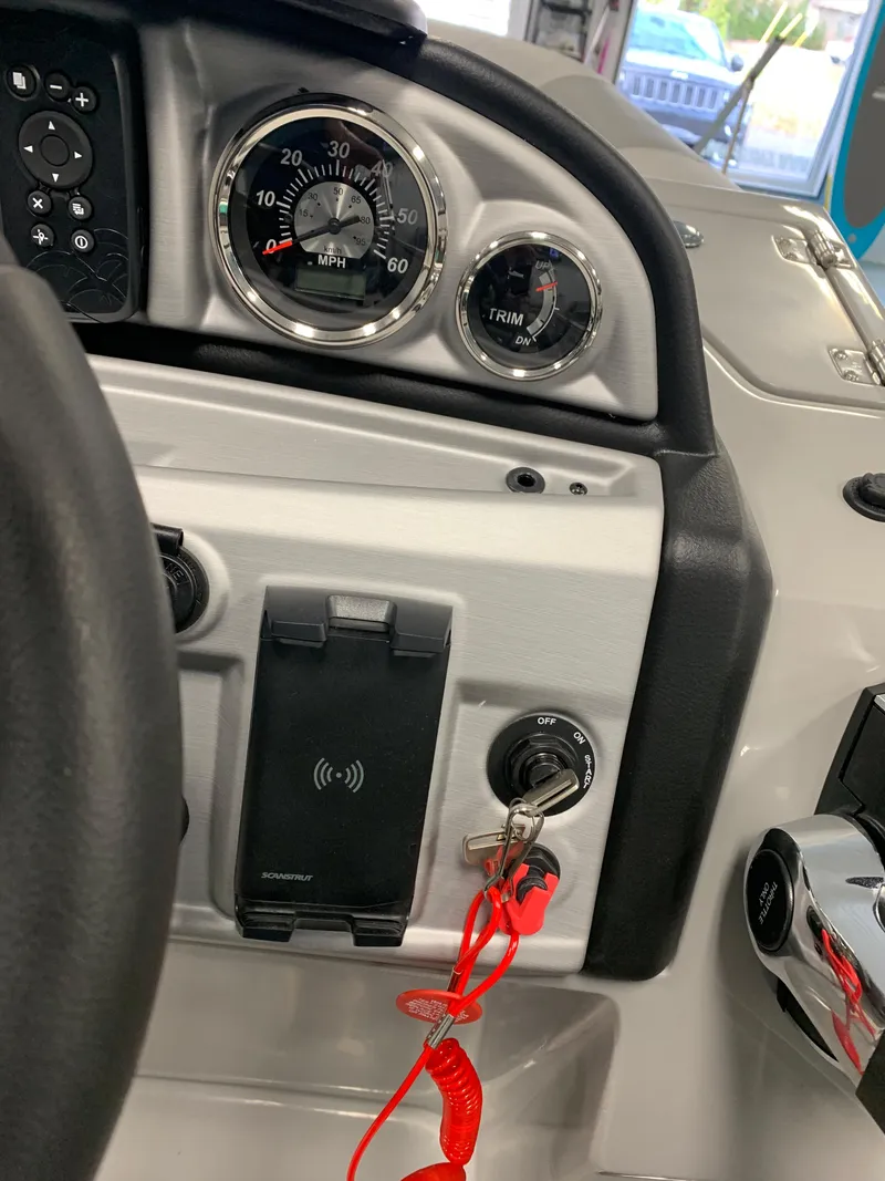 Slide: The Image of Dashboard of a 2023 South Bay S224 RS boat with gauges and controls. - 9