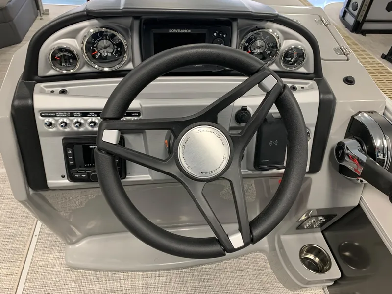 Slide: The Image of 2023 South Bay S224 RS boat dashboard with steering wheel and control panel. - 7