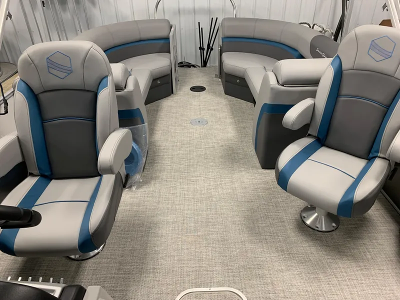 Slide: The Image of 2023 South Bay S224 RS boat interior with gray and blue seating. - 10