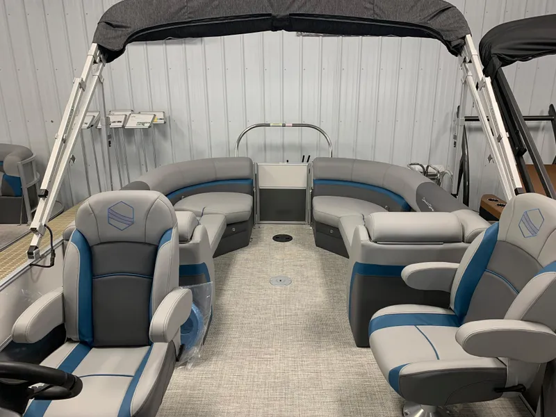Slide: The Image of 2023 South Bay S224 RS pontoon boat interior with gray and blue seating. - 3