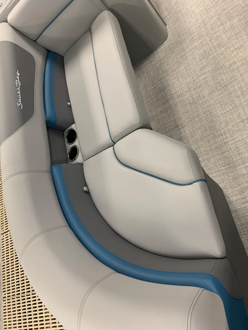 Slide: The Image of 2023 South Bay S224 RS boat interior with gray and blue seating. - 20
