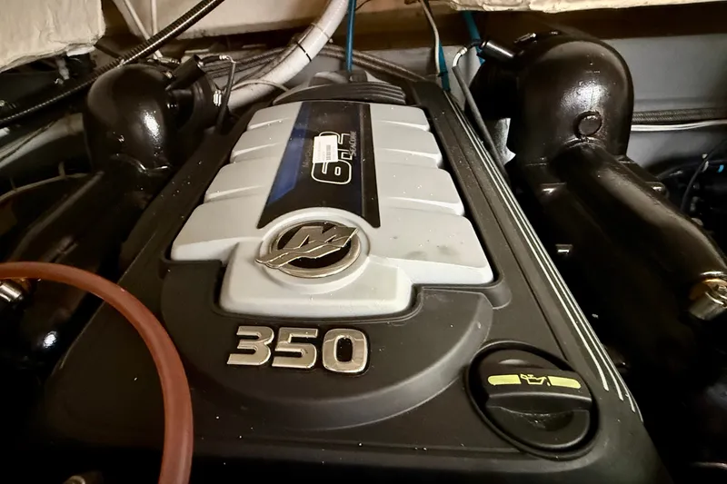 Slide: The Image of Engine of a 2019 Carver C37 Coupe, featuring a 350 horsepower motor. - 50