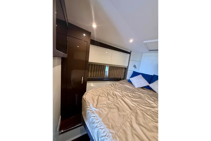 Slide: The Image of Luxurious interior of 2019 Carver C37 Coupe with cozy bed and elegant cabinetry. - 39