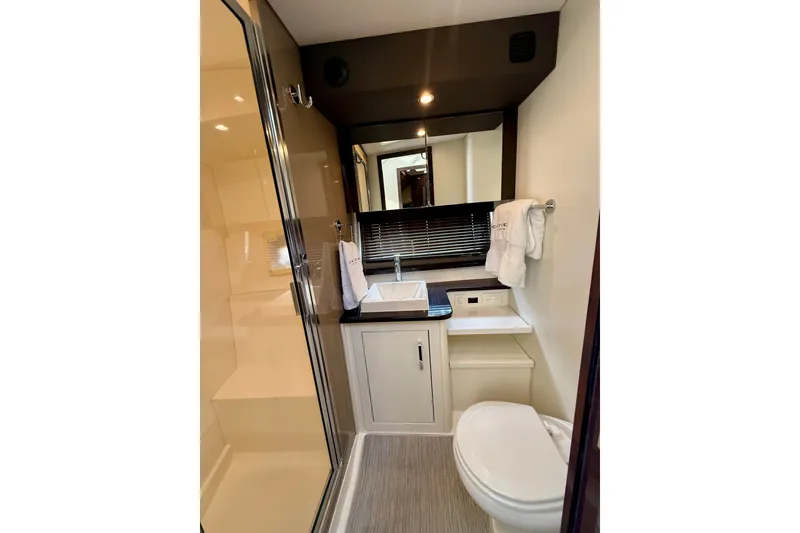Slide: The Image of Luxurious bathroom in 2019 Carver C37 Coupe yacht, featuring modern fixtures and elegant design. - 41