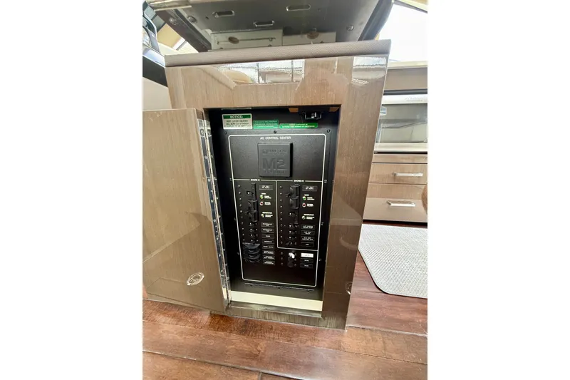 Slide: The Image of Electrical control panel inside a 2019 Carver C37 Coupe yacht. - 56