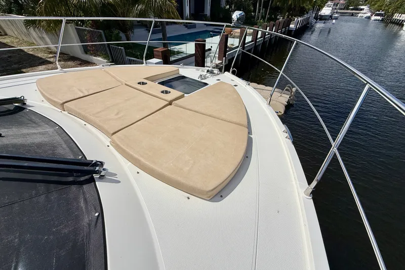 Slide: The Image of Bow view of 2019 Carver C37 Coupe yacht with sun pads and railing. - 28