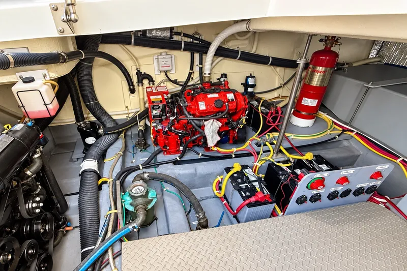 Slide: The Image of Engine room of 2019 Carver C37 Coupe with wiring and fire extinguisher. - 54