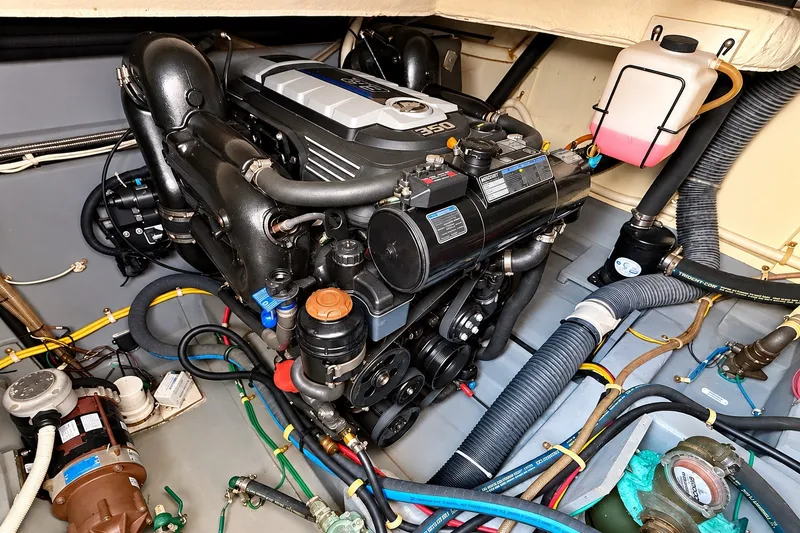 Slide: The Image of Engine compartment of a 2019 Carver C37 Coupe, showcasing detailed mechanical components. - 49