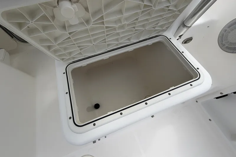 Slide: The Image of Open storage compartment on a 2006 Century 2200 Walk-Around boat. - 13