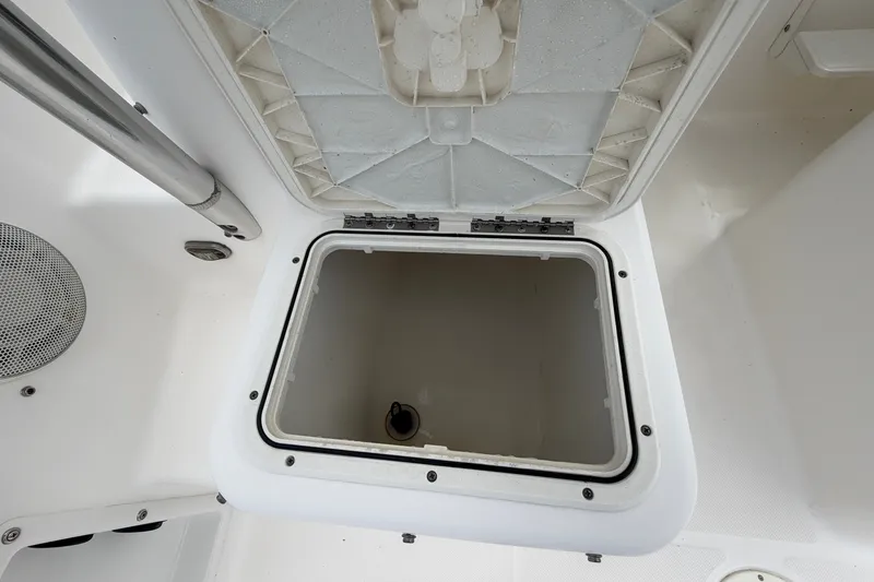 Slide: The Image of Open storage compartment on a 2006 Century 2200 Walk-Around boat. - 14