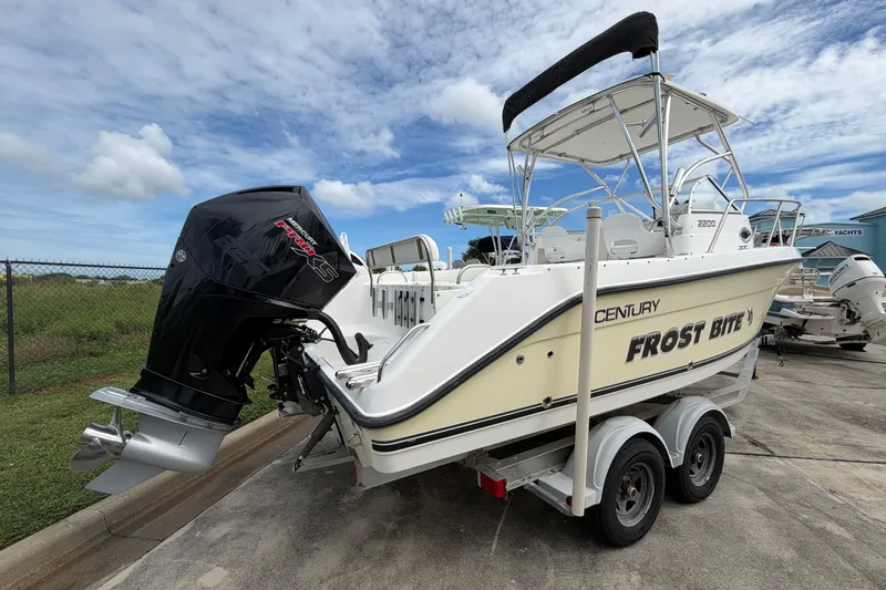 Slide: The Image of 2006 Century 2200 Walk-Around boat with Mercury engine on trailer, labeled "Frost Bite." - 5