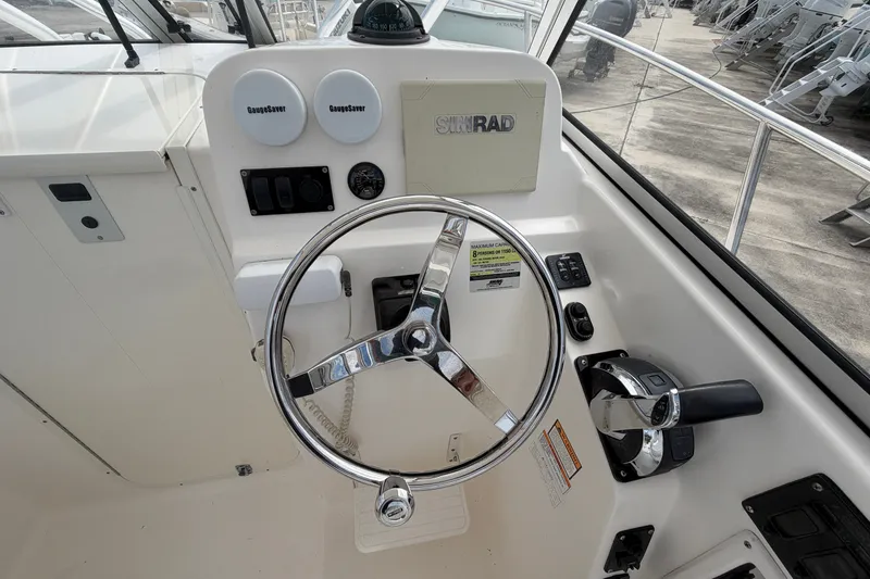 Slide: The Image of Steering console of a 2006 Century 2200 Walk-Around boat with Simrad equipment. - 7
