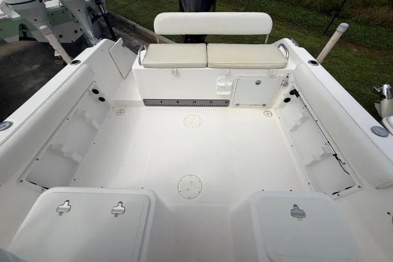 Slide: The Image of 2006 Century 2200 Walk-Around boat interior with seating and storage compartments. - 12