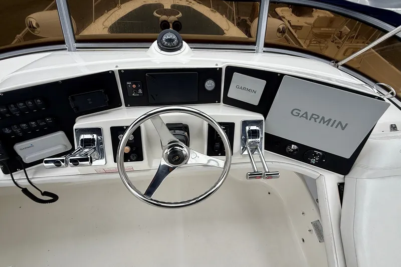 Slide: The Image of Helm of 2003 Regal Commodore 3880 with Garmin navigation system and steering wheel. - 27