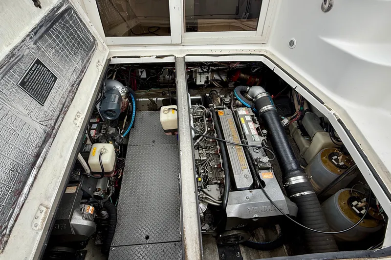 Slide: The Image of Engine compartment of a 2003 Regal Commodore 3880 boat, showcasing mechanical components. - 50