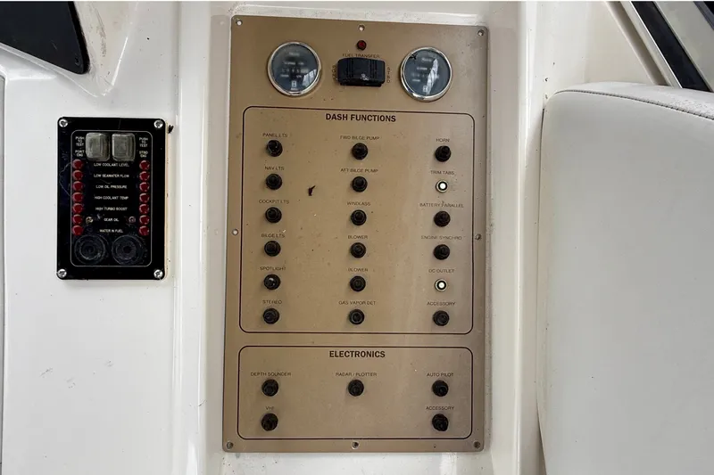 Slide: The Image of Control panel of a 2003 Regal Commodore 3880 boat with various switches and indicators. - 31