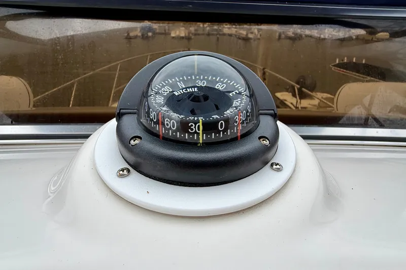 Slide: The Image of Compass on 2003 Regal Commodore 3880 boat dashboard, showing navigation details. - 29