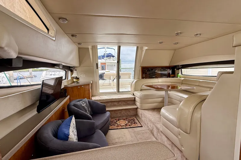 Slide: The Image of Luxurious interior of a 2003 Regal Commodore 3880 yacht with plush seating and elegant decor. - 36