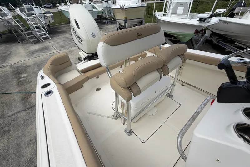 Slide: The Image of 2020 Pioneer 202 Islander boat interior with seating and Suzuki outboard motor. - 12