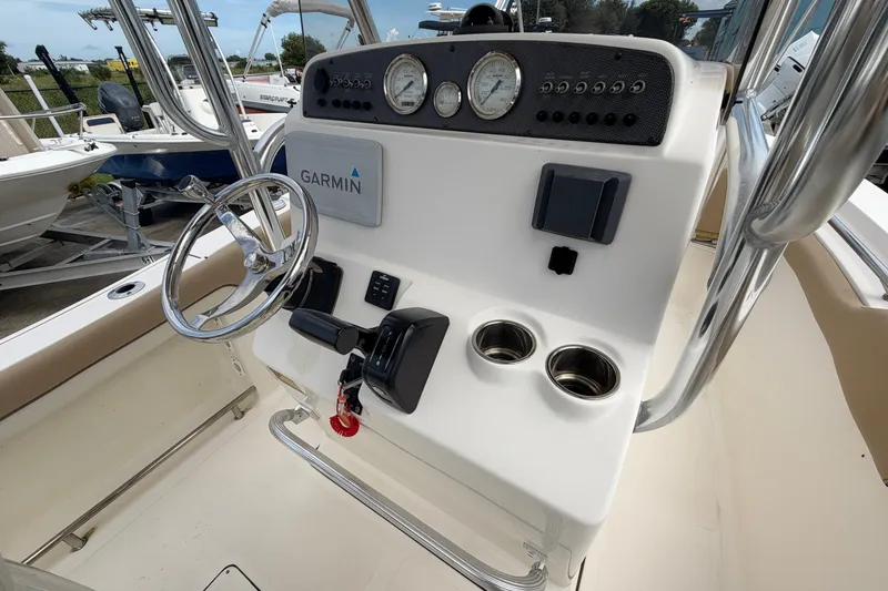 Slide: The Image of 2020 Pioneer 202 Islander boat console with Garmin navigation and steering wheel. - 7