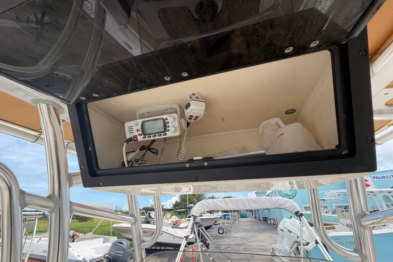 Slide: The Image of 2020 Pioneer 202 Islander boat console with electronic equipment and storage compartment. - 8