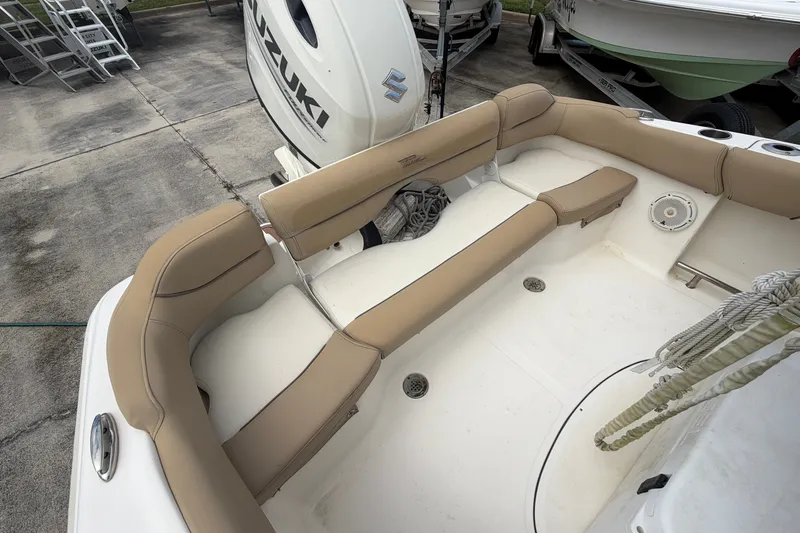 Slide: The Image of 2020 Pioneer 202 Islander boat interior with beige seating and Suzuki engine. - 13