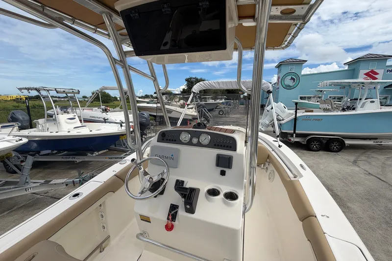 Slide: The Image of Cockpit view of a 2020 Pioneer 202 Islander boat, featuring a Garmin navigation system. - 6