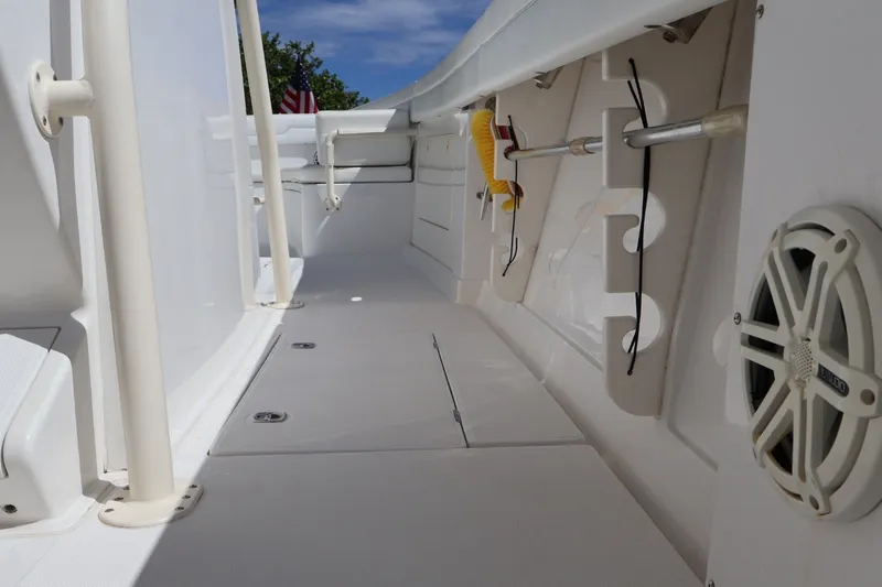Slide: The Image of 2006 Jupiter 38 HFS boat deck with storage compartments and speaker. - 32