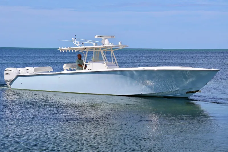 Slide: The Image of 2006 Jupiter 38 HFS boat cruising on calm ocean waters. - 7