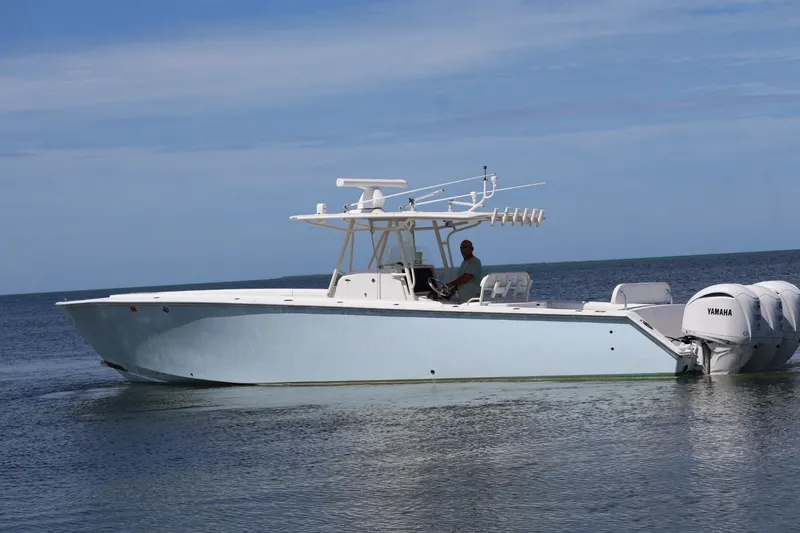 Slide: The Image of 2006 Jupiter 38 HFS boat with Yamaha engines on calm sea. - 22