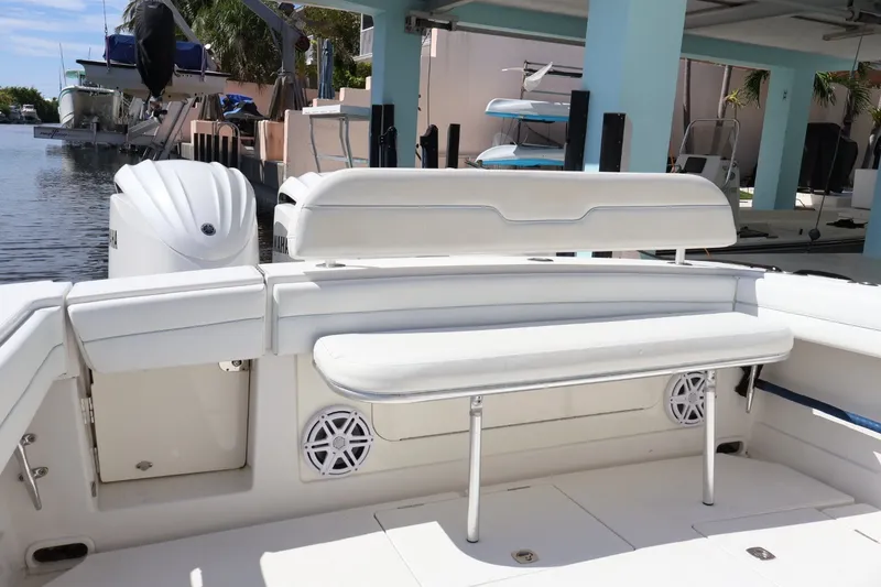 Slide: The Image of 2006 Jupiter 38 HFS boat interior with white seating and Yamaha engines. - 26