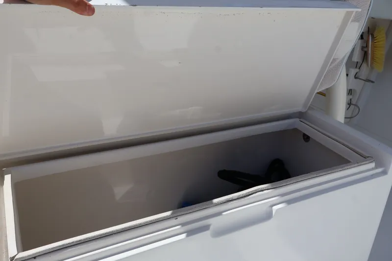 Slide: The Image of Open storage compartment on a 2006 Jupiter 38 HFS boat, showing interior space. - 35