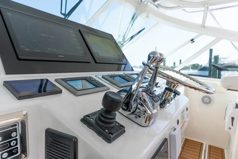 Slide: The Image of Control panel of a 2009 Cabo 40 Express boat with advanced navigation systems. - 21