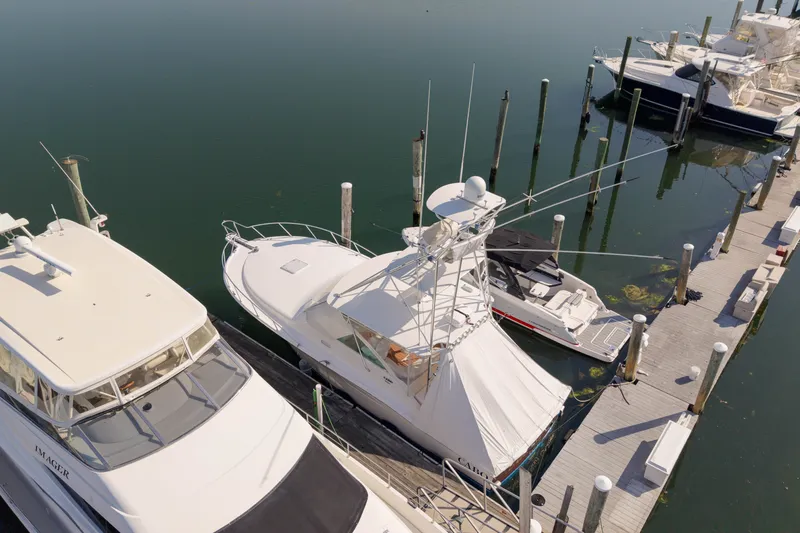 Slide: The Image of 2009 Cabo 40 Express yacht docked at marina, aerial view. - 60