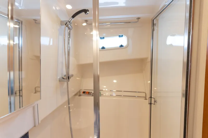 Slide: The Image of 2009 Cabo 40 Express yacht bathroom with shower and glass door. - 39
