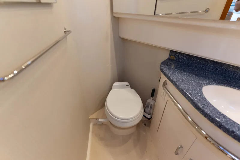 Slide: The Image of Bathroom interior of 2009 Cabo 40 Express yacht with toilet and sink. - 37