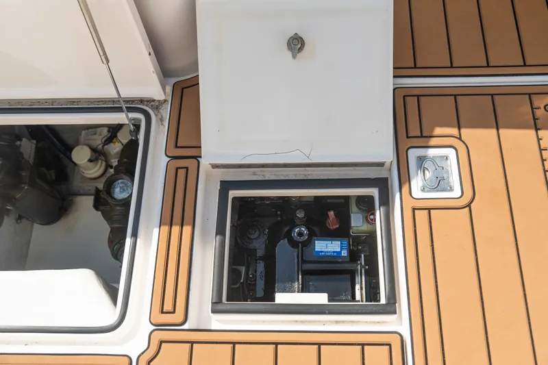 Slide: The Image of Engine compartment of a 2009 Cabo 40 Express boat with teak deck detailing. - 44