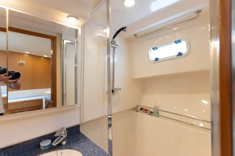 Slide: The Image of Luxurious bathroom interior of 2009 Cabo 40 Express yacht with modern fixtures. - 36