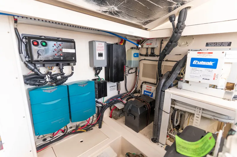 Slide: The Image of Engine room of 2009 Cabo 40 Express boat with electrical systems and components. - 54