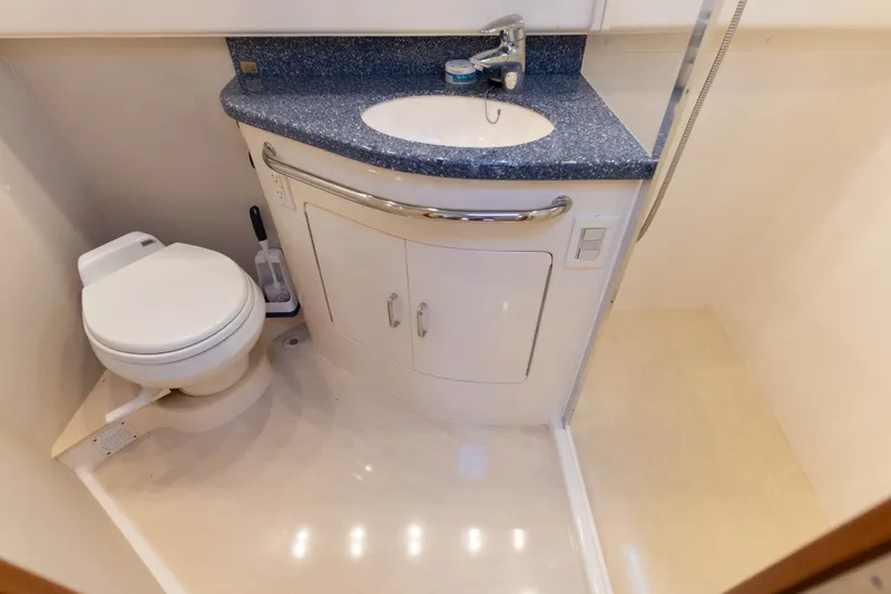 Slide: The Image of Bathroom interior of 2009 Cabo 40 Express yacht with sink and toilet. - 38