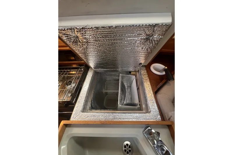 Slide: The Image of Insulated storage compartment on 1989 C&C 30 MKII sailboat, featuring reflective lining. - 70