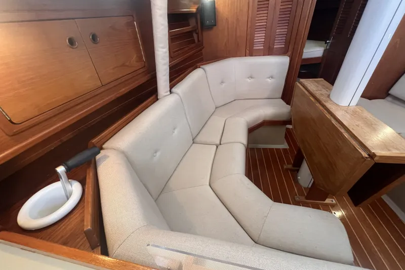 Slide: The Image of Interior of 1989 C&C 30 MKII sailboat with cozy seating and wooden finishes. - 74