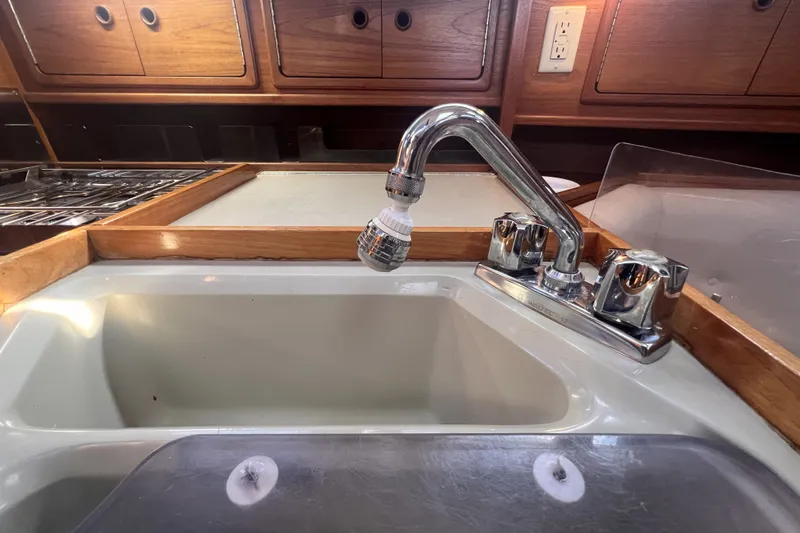Slide: The Image of Galley sink and faucet in 1989 C&C 30 MKII sailboat kitchen. - 65