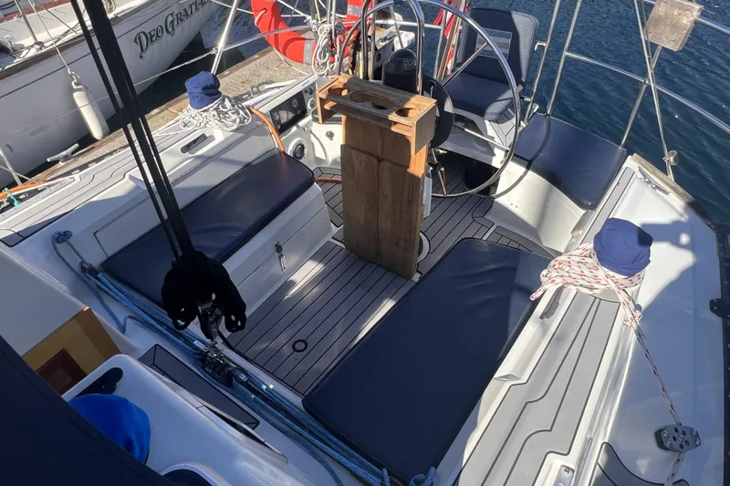 Slide: The Image of Cockpit of 1989 C&C 30 MKII sailboat with seating and steering wheel. - 24