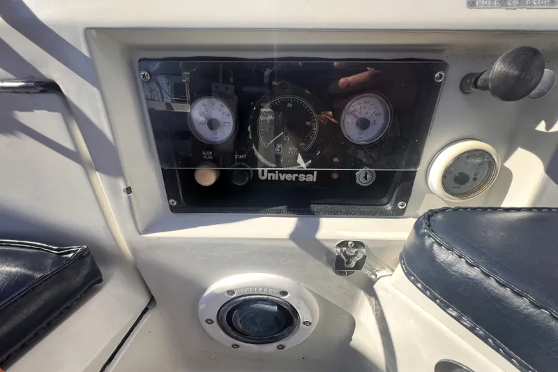 Slide: The Image of Control panel of a 1989 C&C 30 MKII sailboat with gauges and switches. - 37